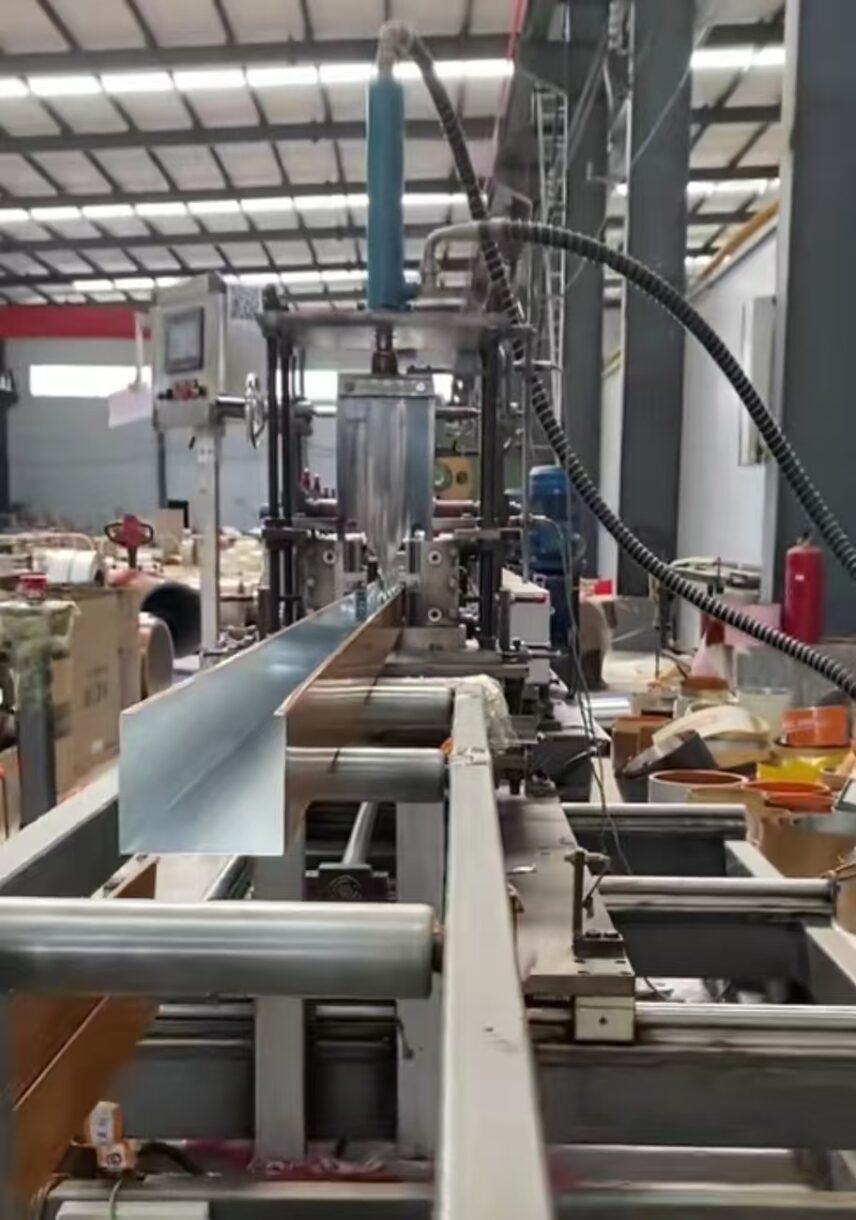 U-shaped aluminum baffle profiles being formed on a factory production line