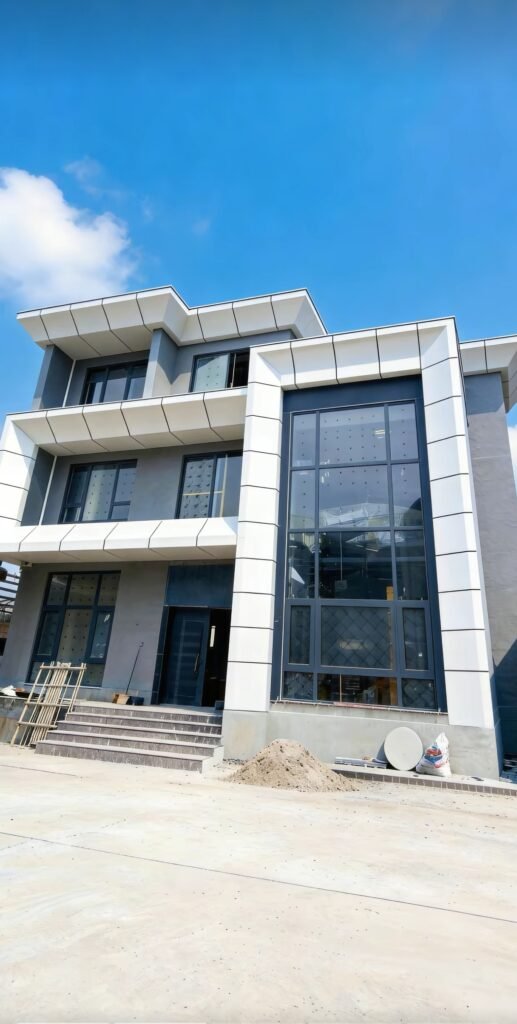 Gray aluminum veneer facade panels on a modern office building entrance