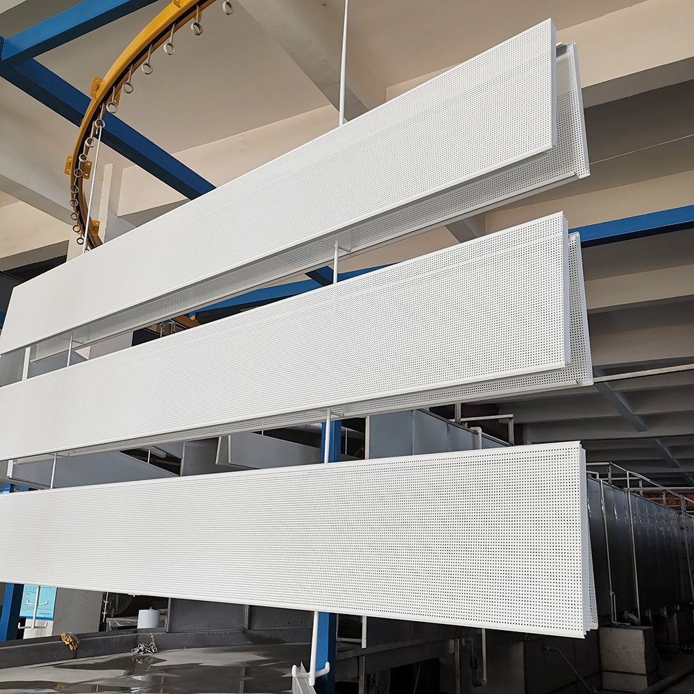 White perforated aluminum strip acoustic ceiling panels in factory production