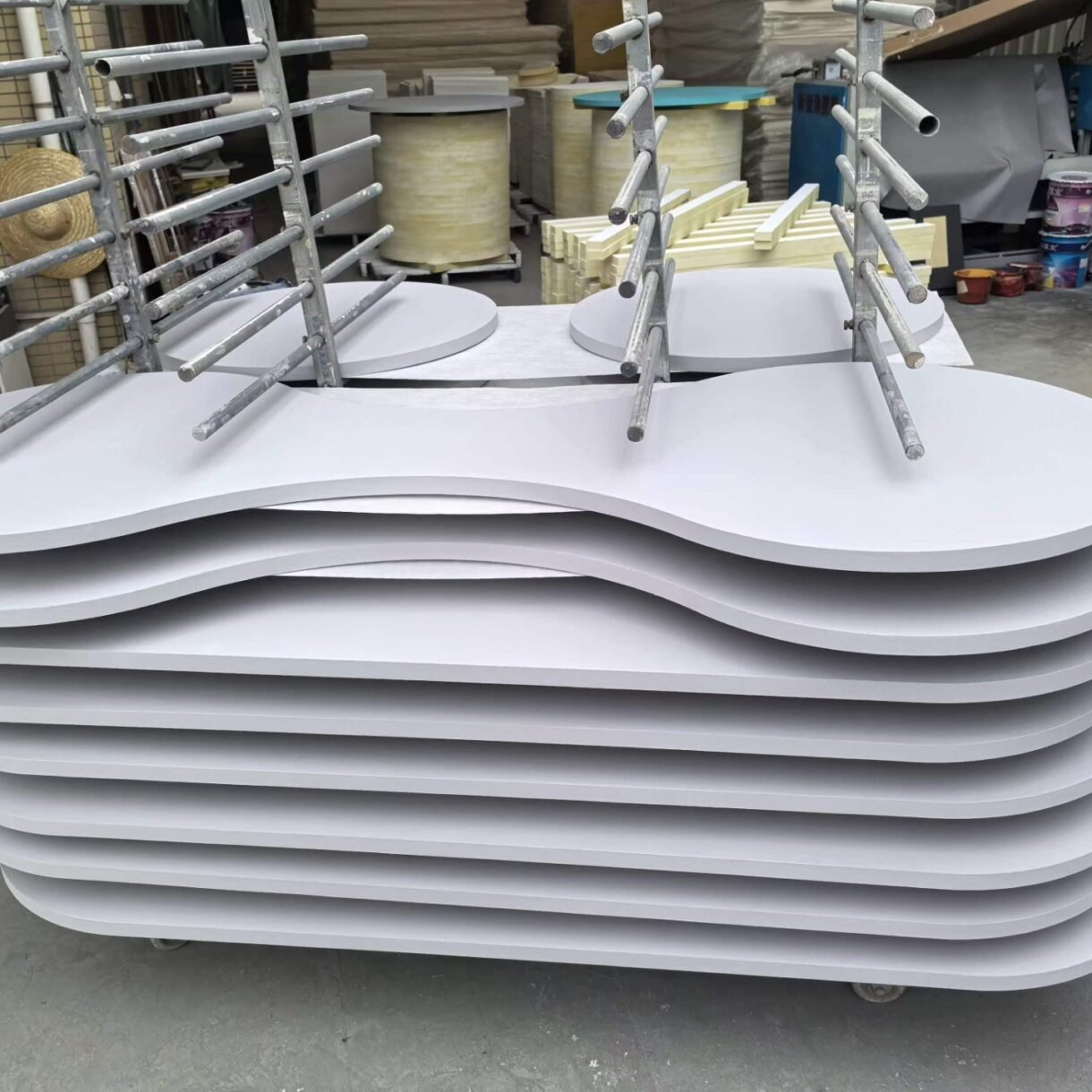 Custom-shaped fiberglass acoustic panels manufactured for architectural soundproofing and acoustic design.