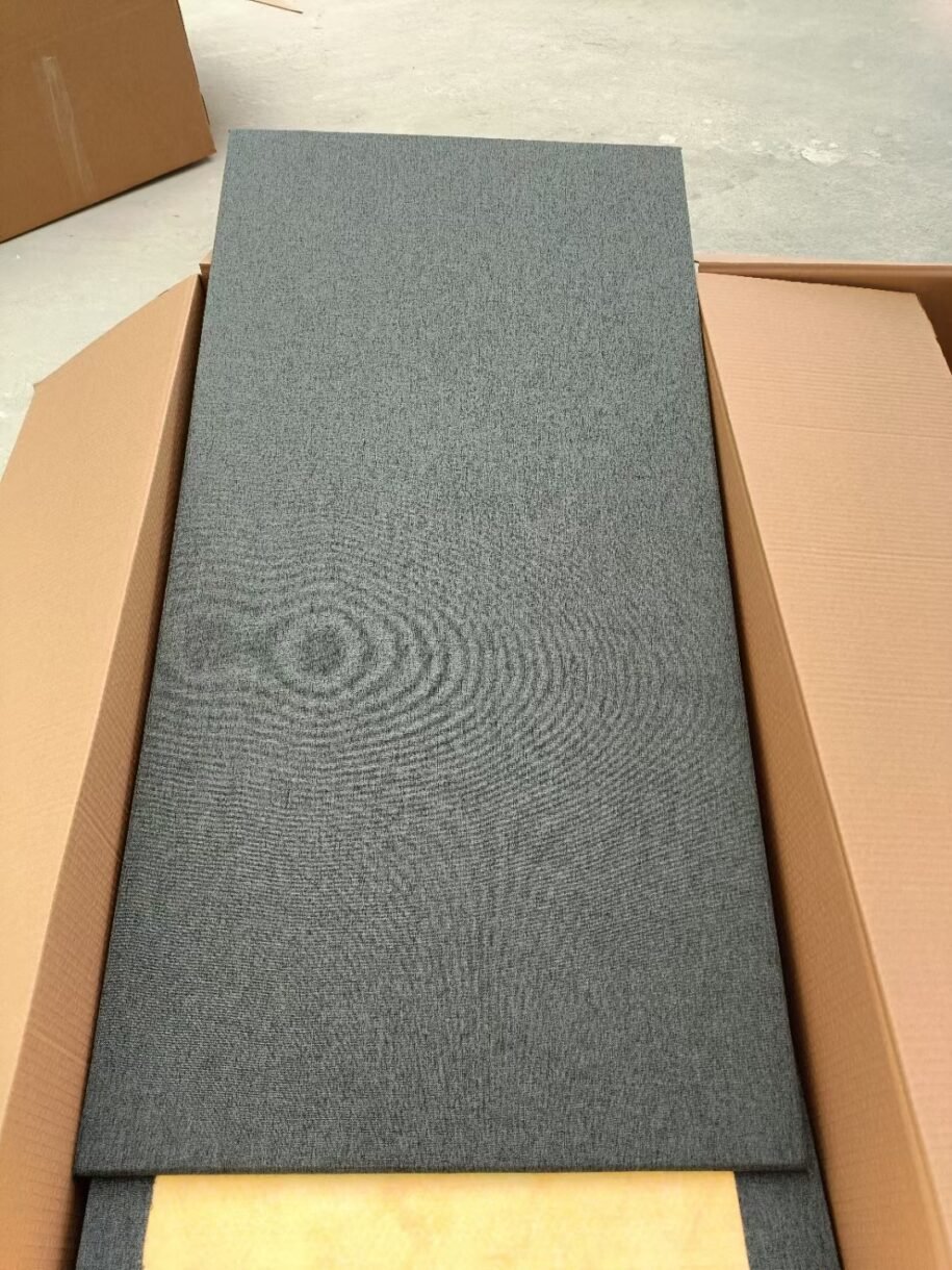 Full-length front view of a black fabric-wrapped fiberglass acoustic panel for commercial noise reduction.