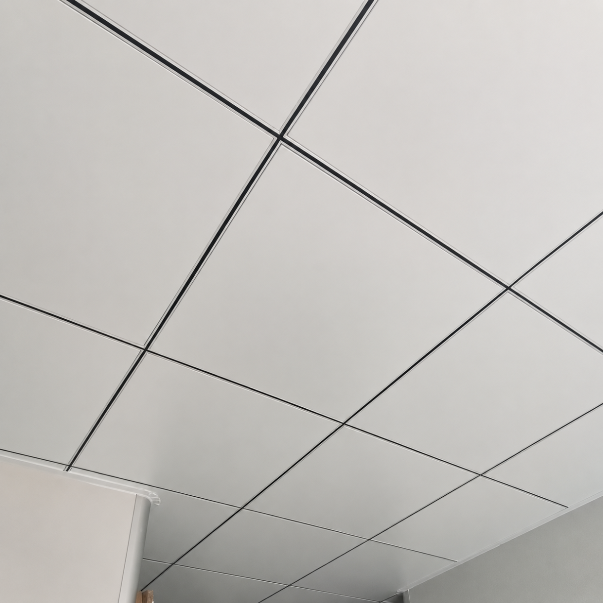 White tegular aluminum ceiling tiles installed in a 600x600mm T-grid system