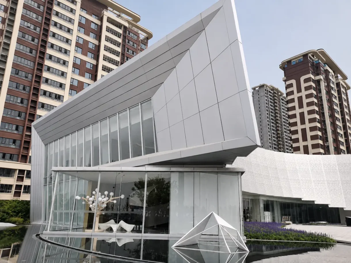 Solid aluminum facade panels on a modern building with an angular exterior design