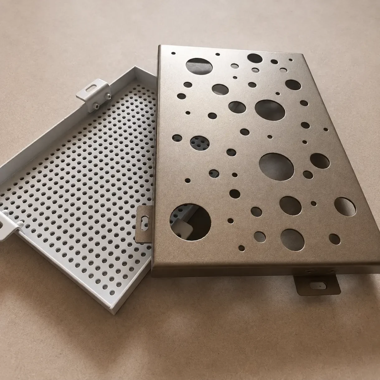Perforated aluminum panel samples with small uniform holes and mixed-size circular holes