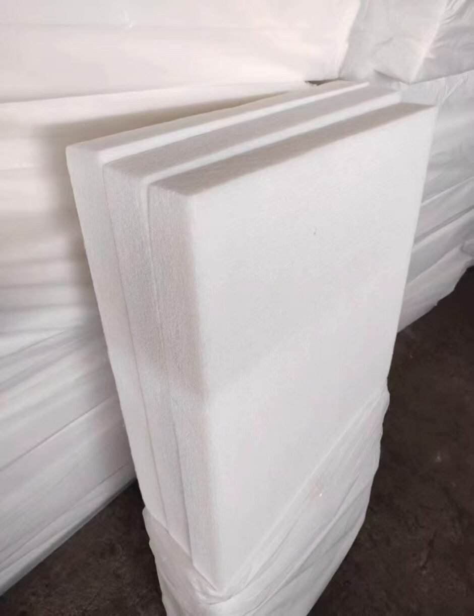 Thick white PET polyester acoustic panels in bulk stock at factory warehouse